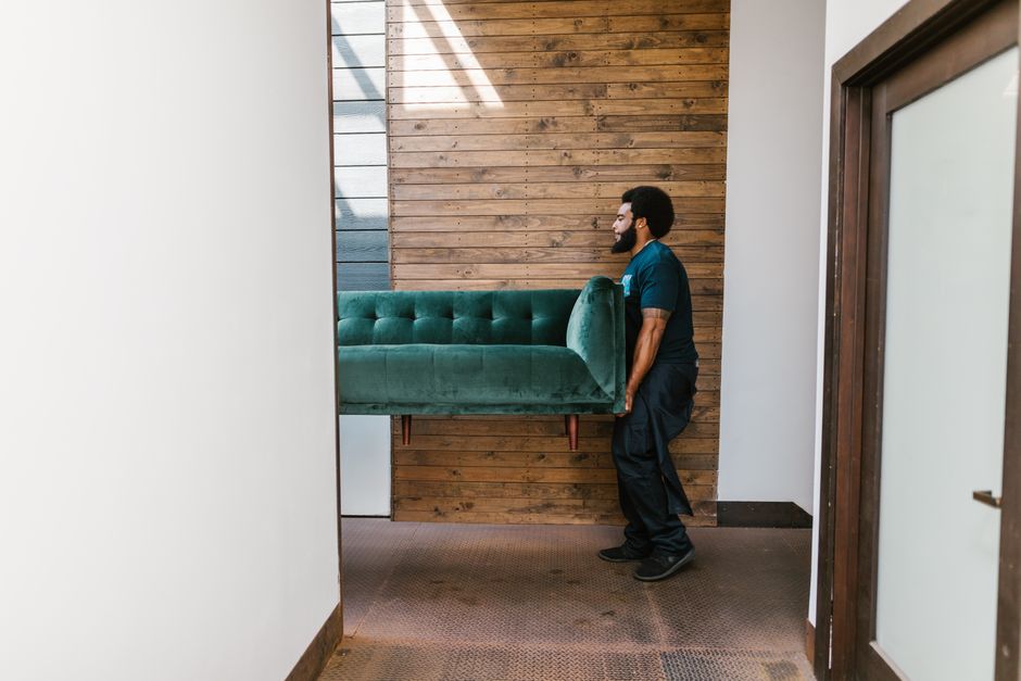 Long distance movers carrying furniture